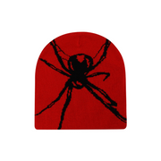 Red mouse pad with a black spider design on a white background