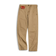 Beige pants with a brand label on a white background