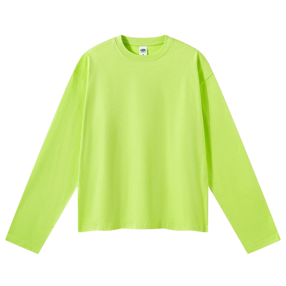 A bright neon yellow-green long-sleeve crewneck t-shirt laid flat against a solid white background.