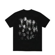 A black short-sleeve crewneck t-shirt featuring a large white graphic print of numerous skeletal hands reaching upwards from a dark, textured background.