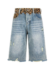 Light blue distressed denim shorts with a leopard-print patterned waistband, shown against a plain white background.