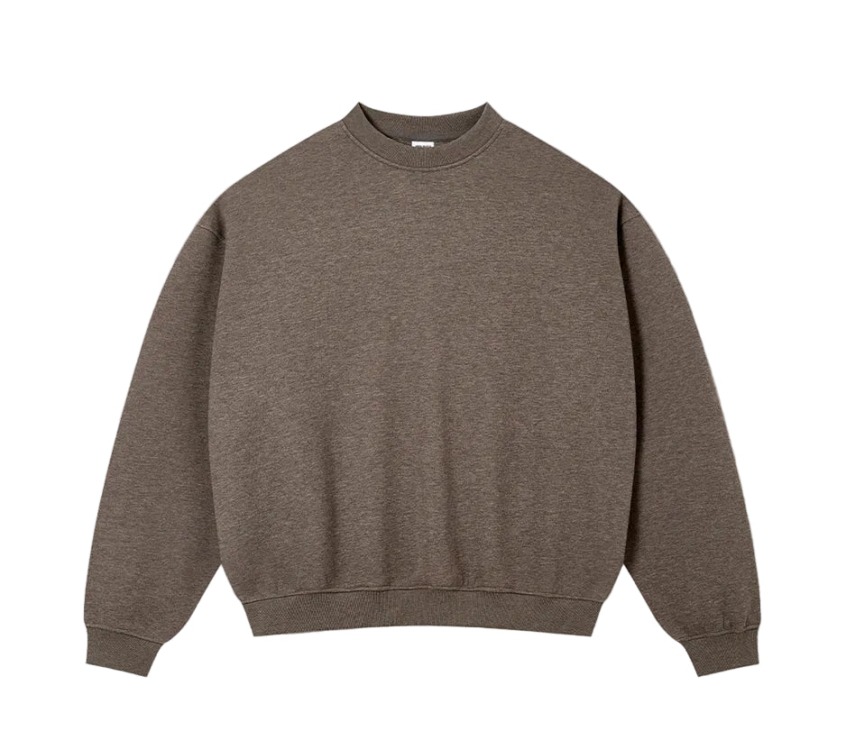 A plain crewneck sweatshirt in a heathered brown color, laid flat against a light textured background. Text below reads 'CELINE BROWN'.