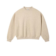 A light beige crewneck sweatshirt laid flat against a textured off-white background, with the text 'HAZE GOLD' printed below it.