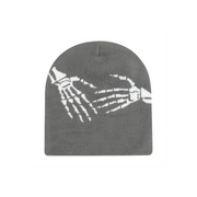 Gray beanie with white skeleton design on a white background