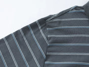Close-up of a dark gray striped shirt fabric with thin white and light blue pinstripes, showing the shoulder seam and collar area.