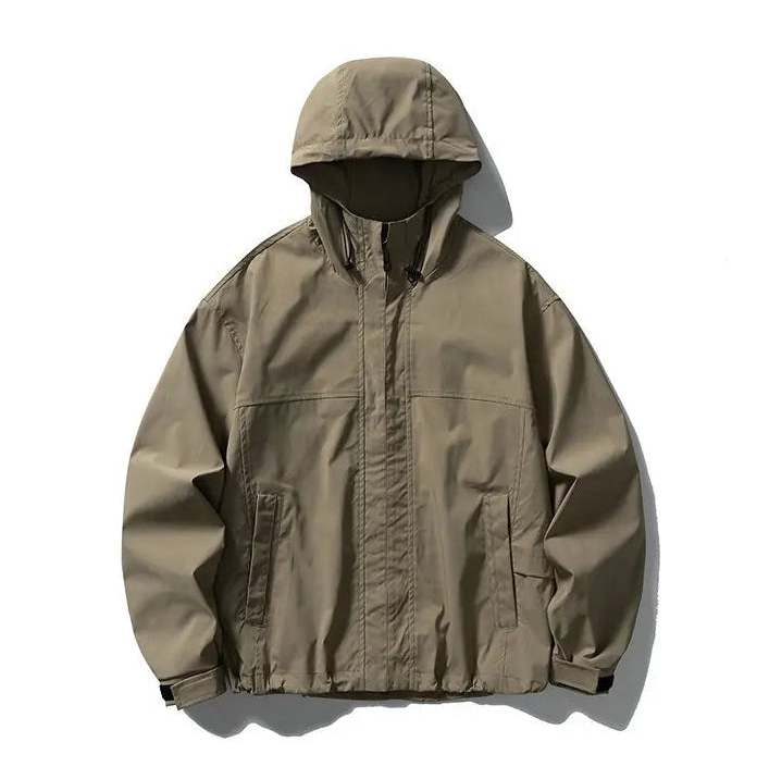 A hooded utility jacket in a muted olive-tan color, laid flat against a clean white background with soft shadows.
