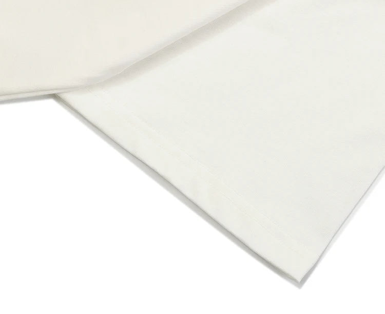 Two white ceramic tiles on a white background