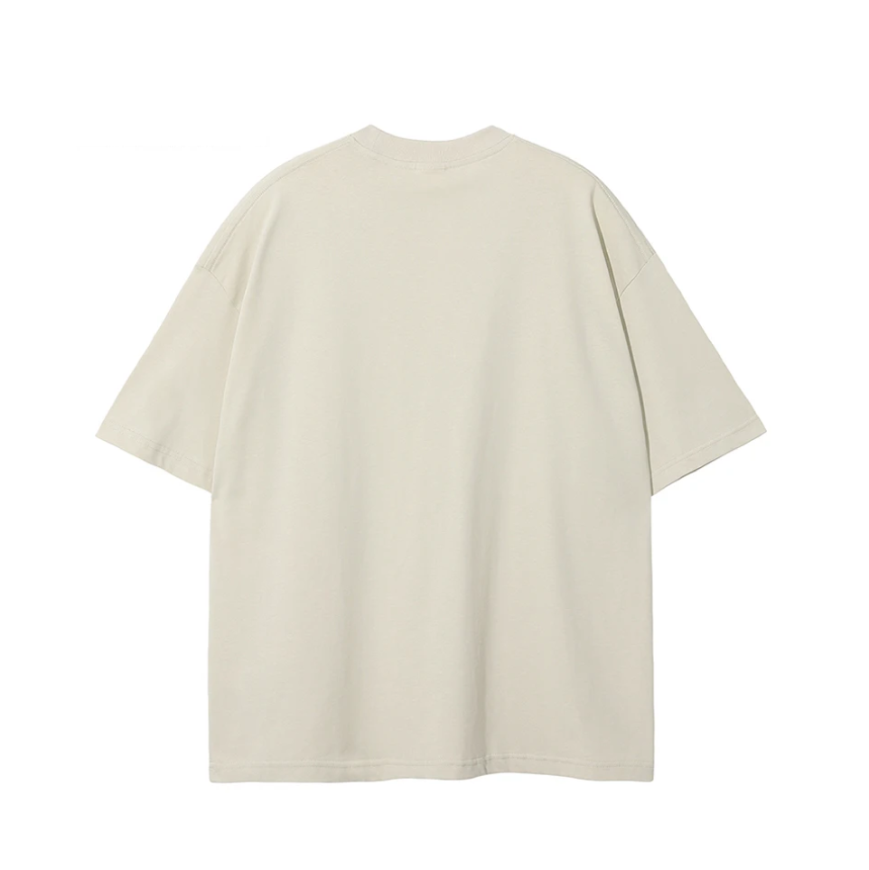 A plain, short-sleeve crewneck t-shirt in a light cream or off-white color, shown from the back against a solid white background.