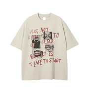 An oversized cream-colored t-shirt with a graphic print featuring red handwritten text and black-and-white images, displayed flat against a white background.