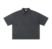 A dark gray short-sleeve polo shirt with a classic collar and a two-button placket, displayed flat against a solid white background.