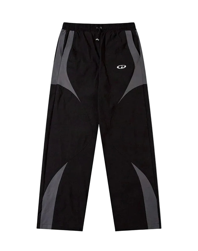 Black and gray athletic pants with a white logo on the left thigh, displayed on a white background.